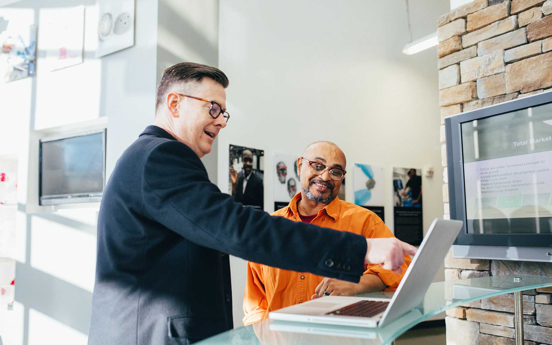 Two men having a discussion in a modern office